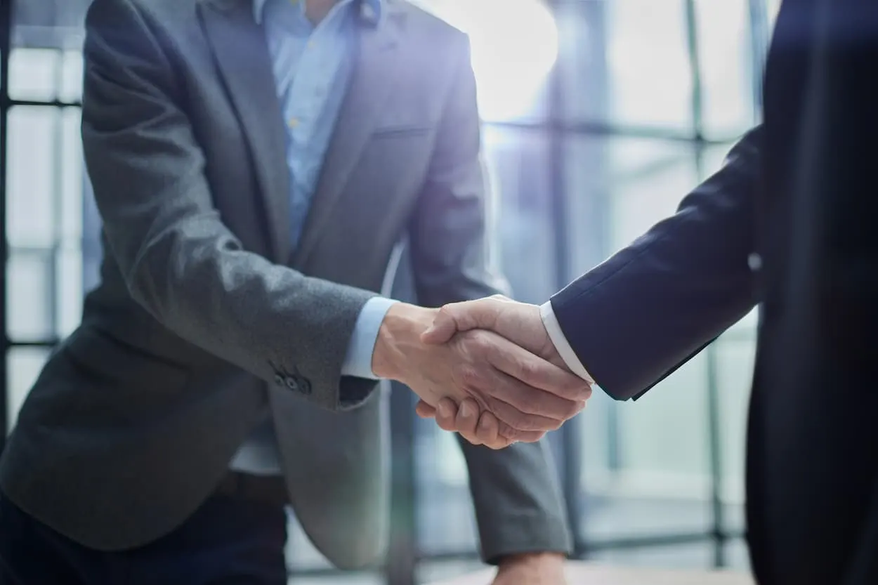 Business partners shaking hands